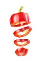 Red bell pepper sliced in rings, flying in the air Royalty Free Stock Photo